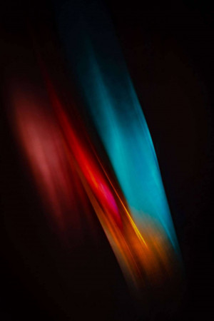 Abstract image of colorful light streaks against a black background