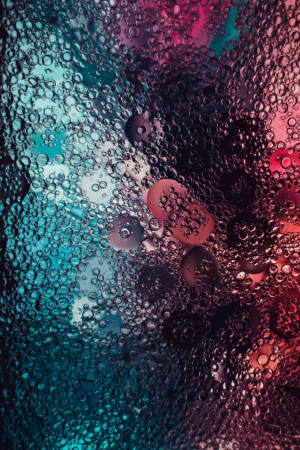 Close-up of colorful water bubbles creating an abstract pattern