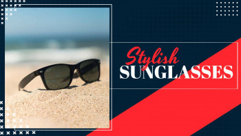 Black sunglasses resting on a sandy beach with a blue ocean background and a red and blue graphic overlay.