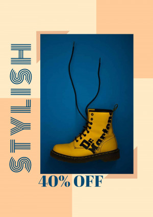 Yellow Dr. Martens boots with laces hanging, advertising a 40% off sale.