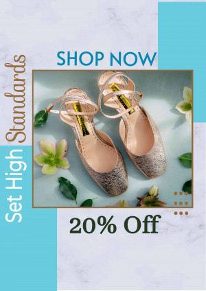 Close-up of sparkling gold heels with floral decorations and a sale promotion.