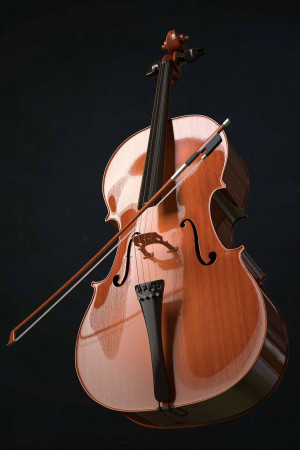A detailed image of a brown cello with a bow resting against it.