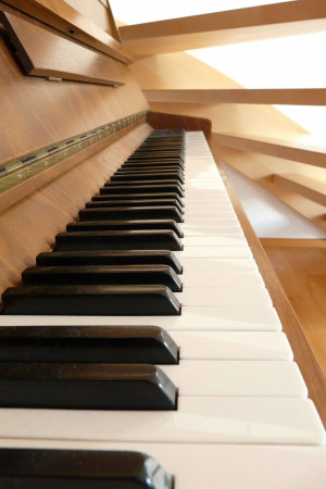 Close-up of a piano keyboard with black and white keys