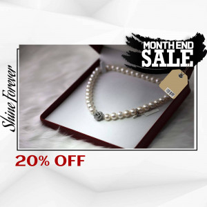 Pearl necklace in a red box with a sale tag