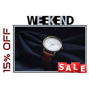 Close-up of a wristwatch on a folded navy blue fabric with a sale promotion.