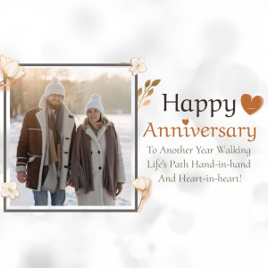 A couple walking in the snow with a Happy Anniversary message.
