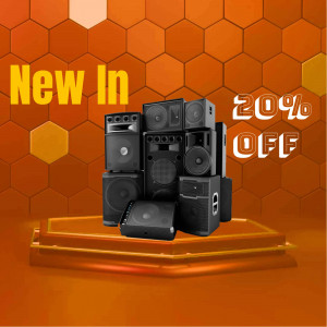 Stack of speakers on a platform with a promotional banner