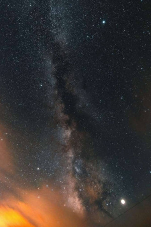 A stunning view of the Milky Way galaxy stretching across the night sky.