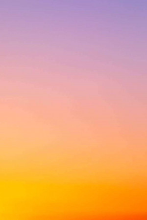 Abstract gradient background transitioning from yellow to orange, pink, and purple.