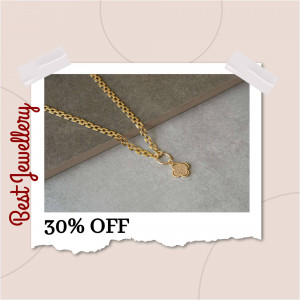 Close-up of a delicate gold clover necklace on a neutral background with a promotional offer.
