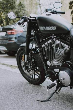 Close-up of a black Harley-Davidson motorcycle parked on a street
