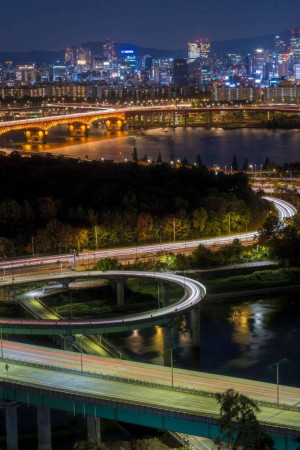 Night view of Seoul, South Korea with illuminated buildings and bridges
