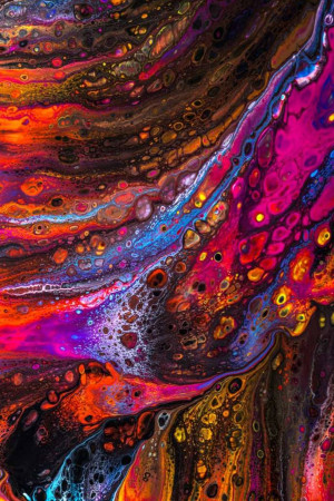 Close-up of vibrant and colorful fluid acrylic pour painting