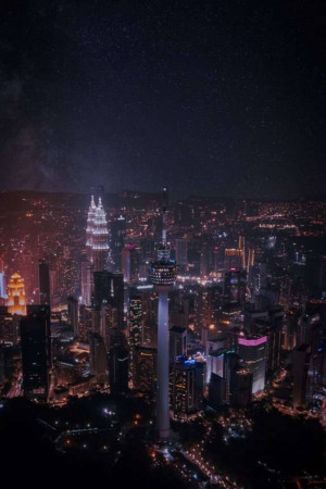 Night view of Kuala Lumpur city skyline with the Petronas Towers and KL Tower illuminated