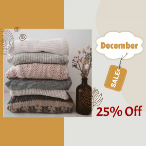 Stack of folded sweaters with a December sale promotion