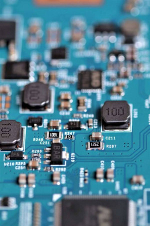 Close-up view of a blue circuit board with electronic components
