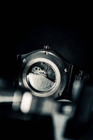 Close-up of the back of a Hublot watch showcasing its intricate mechanism.