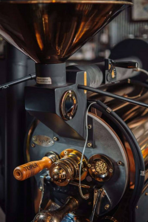 Close-up of a vintage coffee bean grinder machine