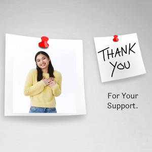 Woman expressing gratitude with a thank you note