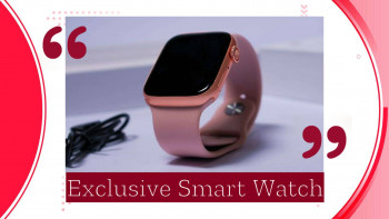 Close-up of a rose gold smartwatch with a charging cable