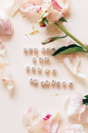 Peonies and letter blocks spelling 'You Can Try Again Tomorrow'