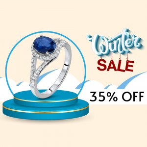 Silver ring with a blue sapphire gemstone on a pedestal with a winter sale promotion.