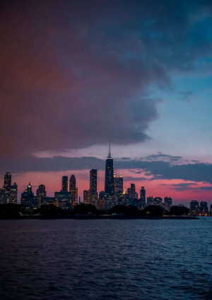 City skyline of Chicago at twilight with dramatic clouds