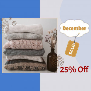 Stack of knitted sweaters with a December sale promotion