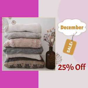 Stack of folded sweaters with a December sale promotion