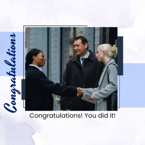 Two business professionals shaking hands with a third colleague.