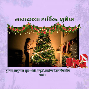 A woman decorating a Christmas tree with festive decorations and gifts.