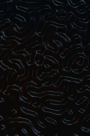 Close-up of a dark, flowing abstract pattern with orange highlights