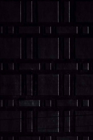 Close-up of a dark, textured grid pattern