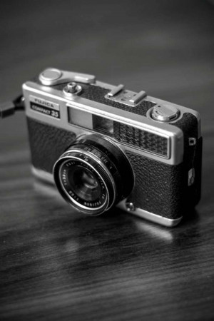Close-up of a vintage Olympus Compact 35 camera in black and white