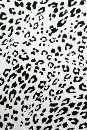 Close-up of a black leopard print on a white background