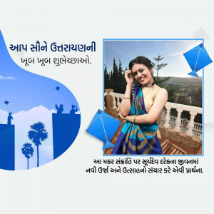 Woman in traditional attire with kites for Uttarayan festival