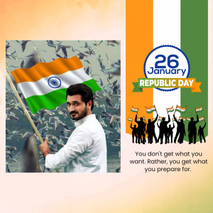 Indian man holding the national flag with a Republic Day background