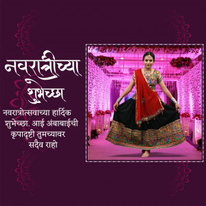 A woman in traditional Navratri attire performing Garba dance with festive decorations in the background.