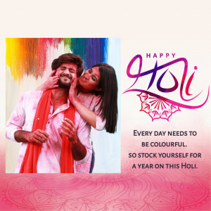 A couple covered in colorful powder celebrating the festival of Holi.