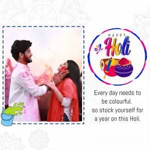 Couple celebrating Holi with colors and festive decorations