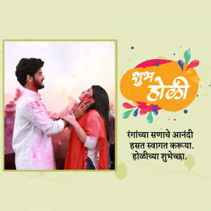 A couple celebrating Holi, covered in colorful powder.