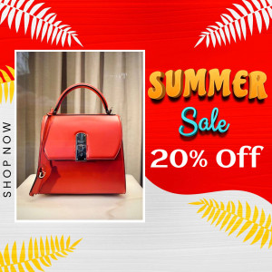 Red handbag on display with a summer sale promotion