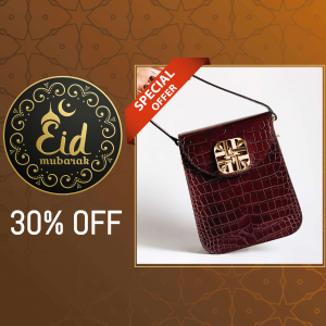 Close-up of a red crocodile-texture handbag with a gold clasp, advertised with a 30% off Eid Mubarak special offer.