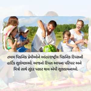 A happy family enjoying a picnic outdoors with watermelon.