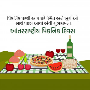 Picnic spread with food and drinks on a checkered blanket