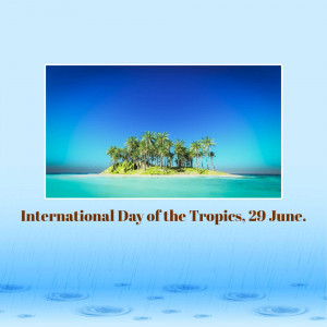 Tropical island with palm trees surrounded by blue water, celebrating International Day of the Tropics.