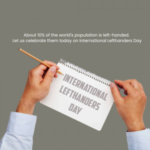 Hands holding a notebook with 'International Lefthanders Day' written on it