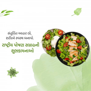 A top-down view of a vibrant chicken salad in a black bowl, garnished with fresh greens.
