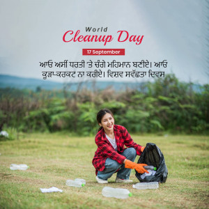 A woman picking up trash in a field for World Cleanup Day