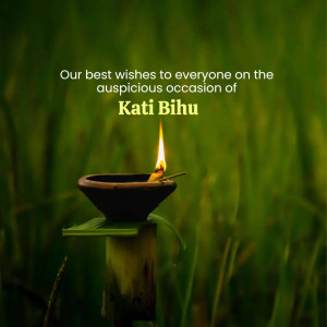 A lit oil lamp with Kati Bihu wishes in the background.